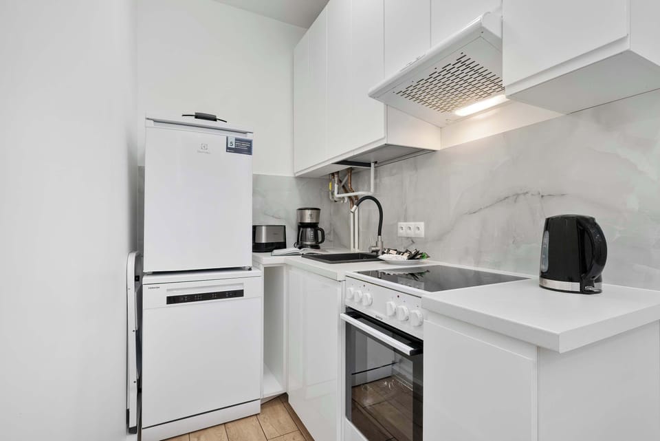 The kitchen offers a functional layout for convenient cooking.