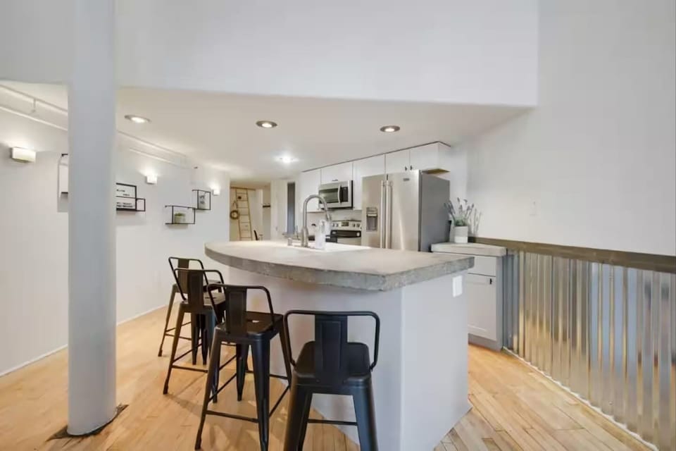 Kitchen island has 4 barstools