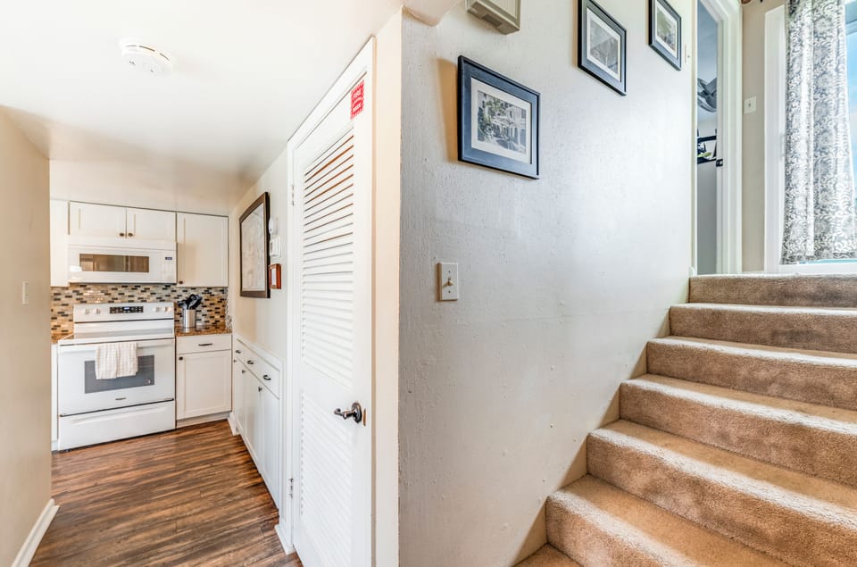 Step into your welcoming home base with a fully equipped kitchen ready for meal prep and cozy touches throughout.