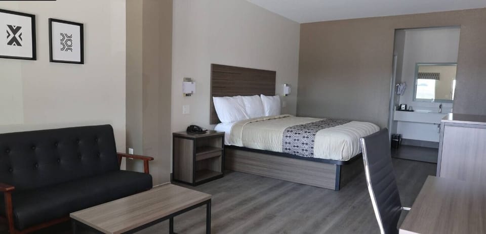 Desk, laptop workspace, blackout drapes, iron/ironing board