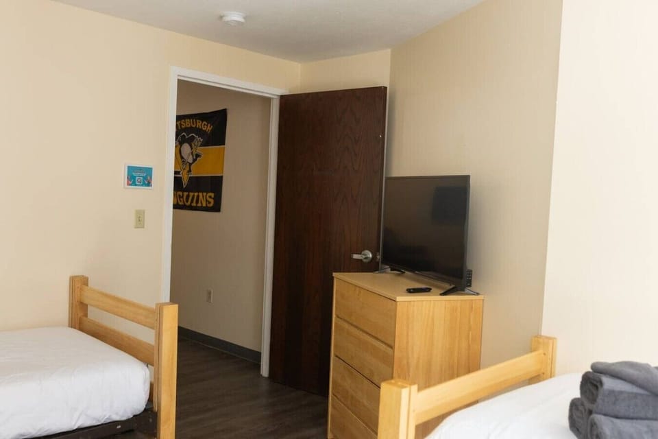 Pittsburgh Penguins banner adds a fun local sports touch to the space.