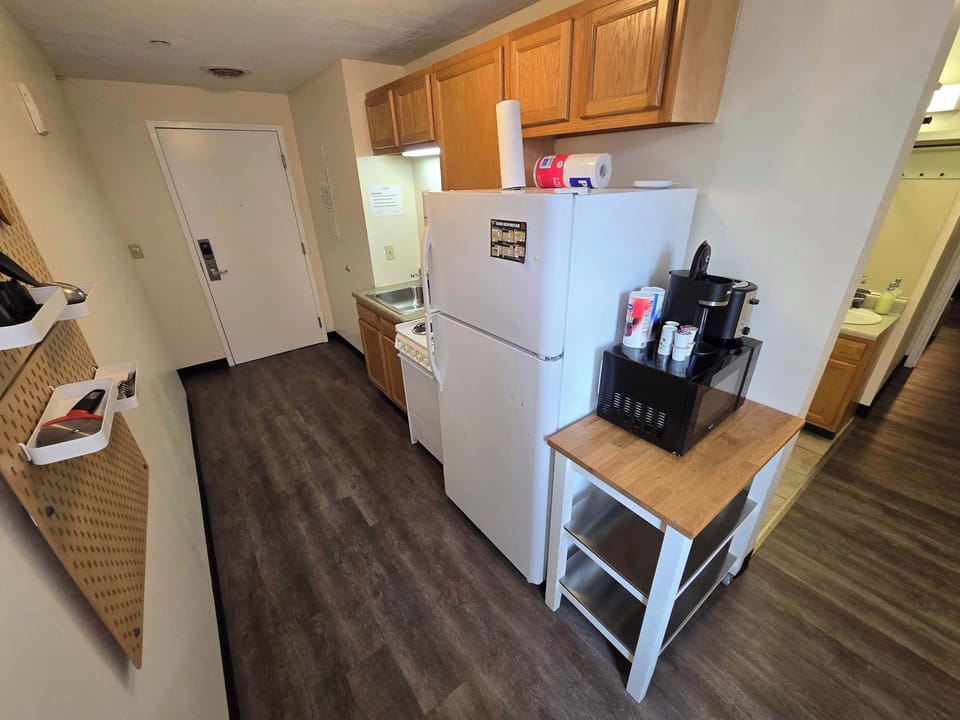 Compact Kitchen with Coffee Station and Entry Access