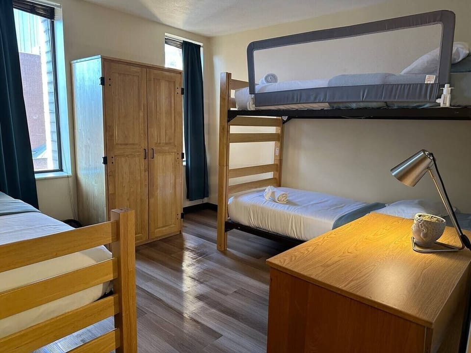 Spacious bunk bed room ideal for groups, friends, or family stays.