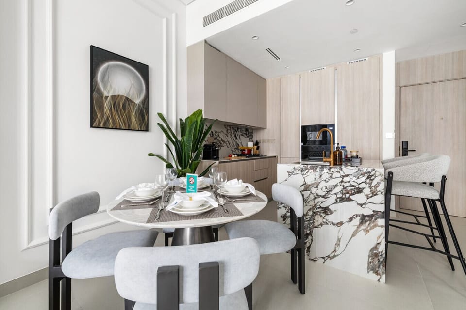 Elegant dining setup with plates, cups, spoons, and a protective cloth for a tidy meal