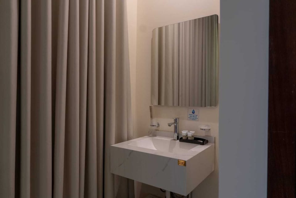 Slippers, bidet, towels, soap