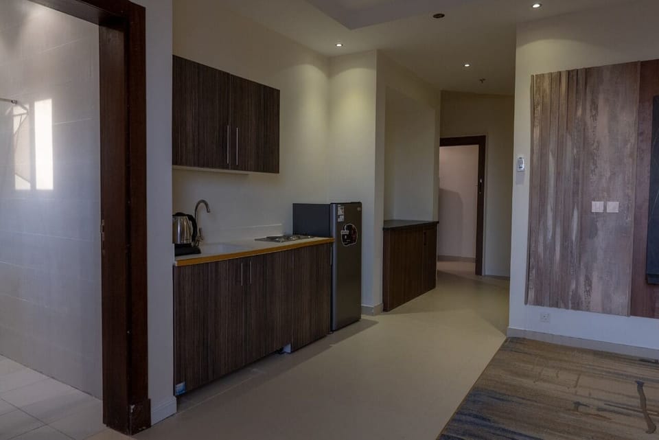 Family Suite, City View | Living area | TV