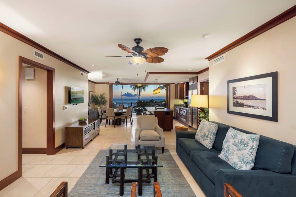 Open-plan living and dining space with lanai access.