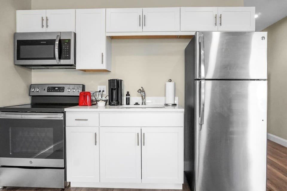 Fully-stocked kitchen with brand-new stainless steel appliances.