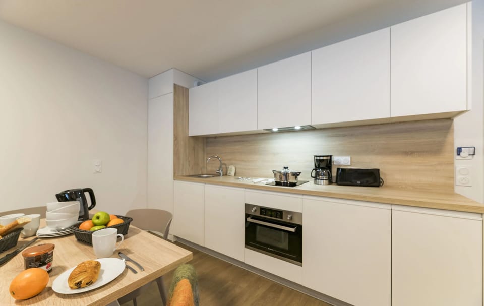 Enjoy culinary delights in a stylish kitchen, well-equipped for romantic meals made easy after exhilarating days on the slopes.