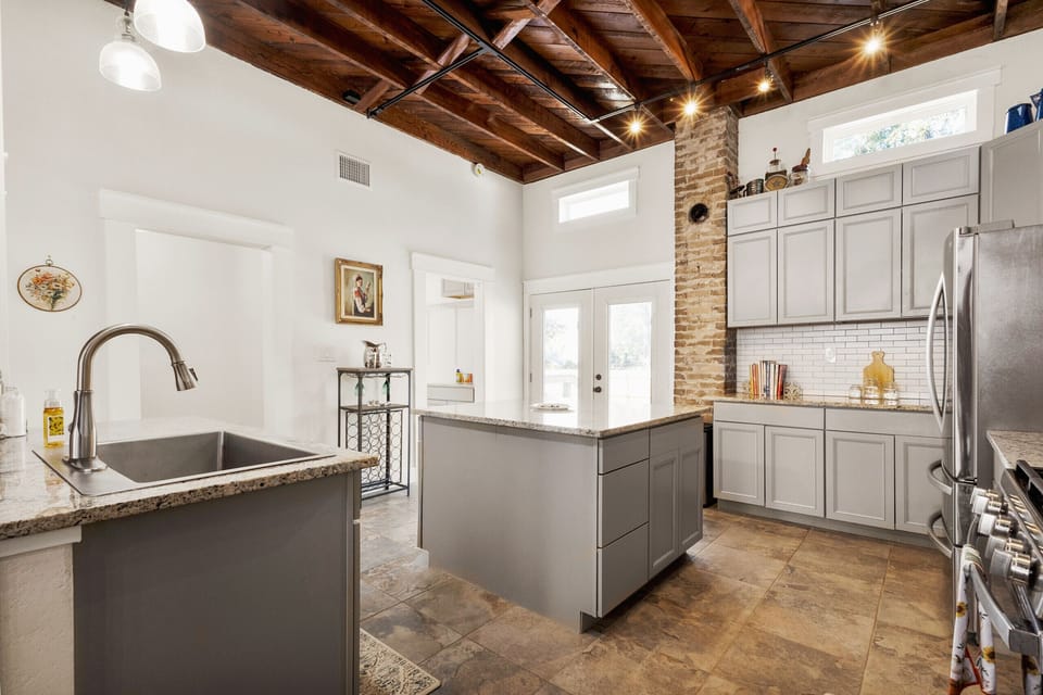 Spacious and well-lit space for cooking and socializing.