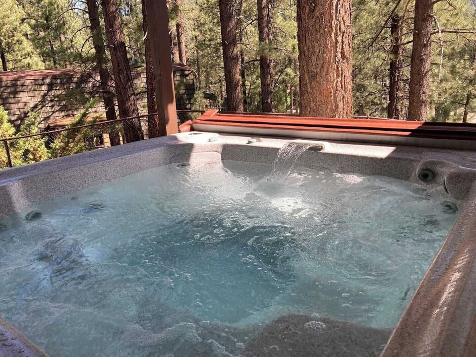 Peaceful hot tub hideaway amongst soaring pines.