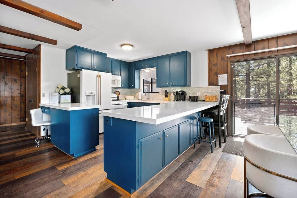 Remodeled kitchen, new granite counter tops, new appliances, Keurig coffee maker, toaster, blender, counter seating, special workstation for laptop, screen door to expansive outdoor, deck.