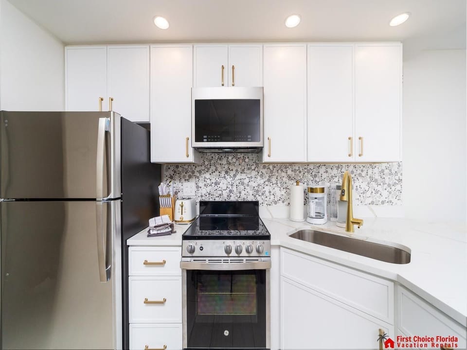 Modern kitchen with sleek appliances and bright cabinetry!