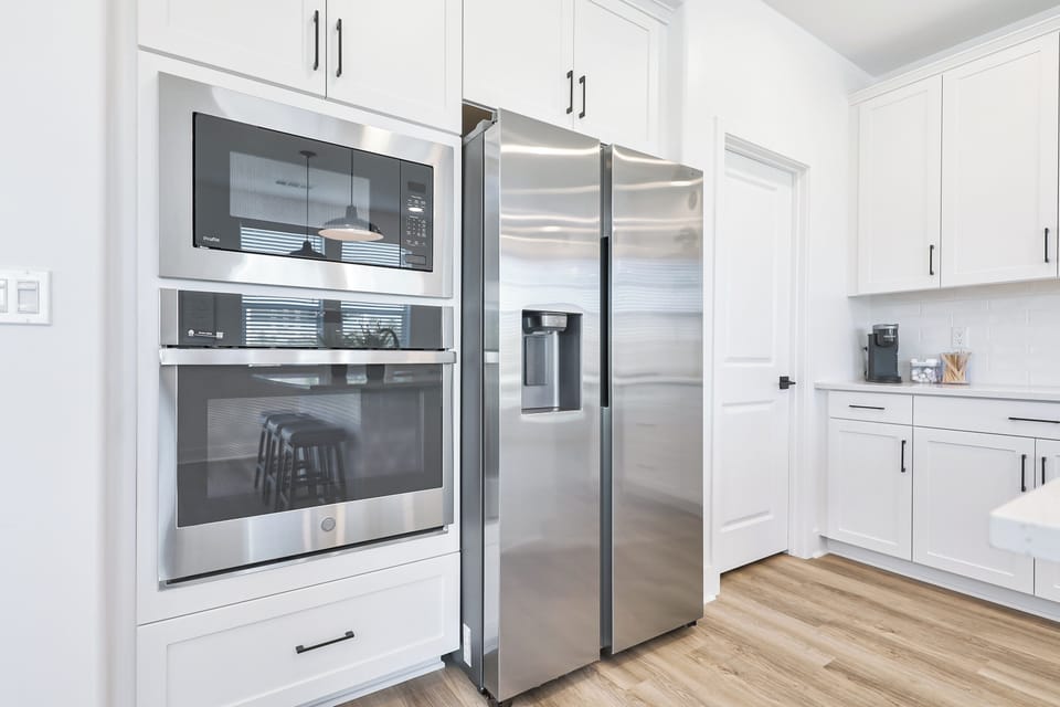 Spacious kitchen with full sized refrigerator perfect for long stays.