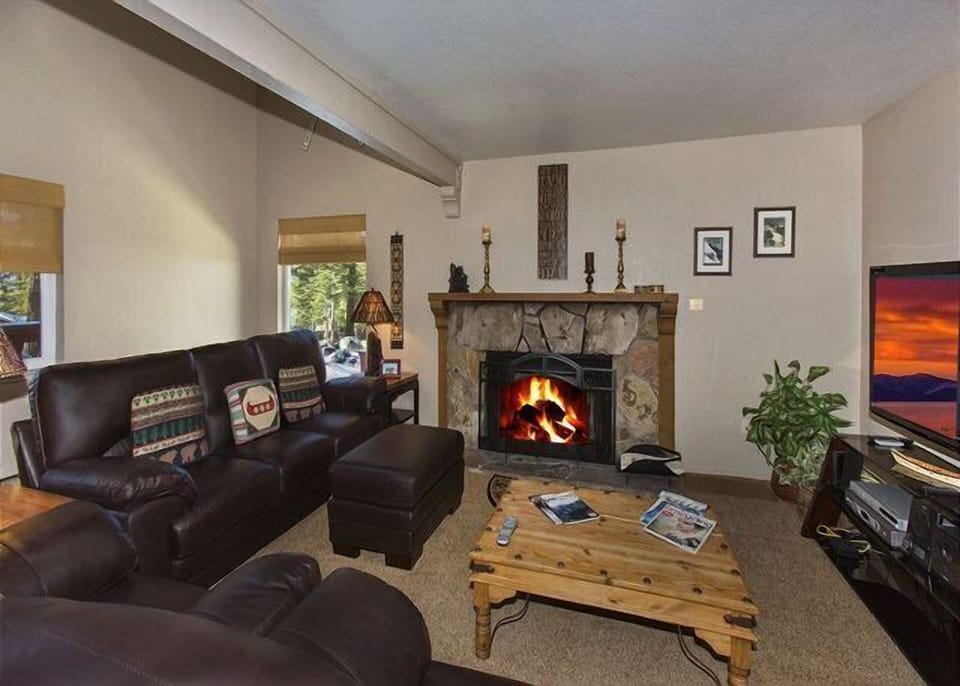 Comfortable Living Room with Wood Burning Fireplace