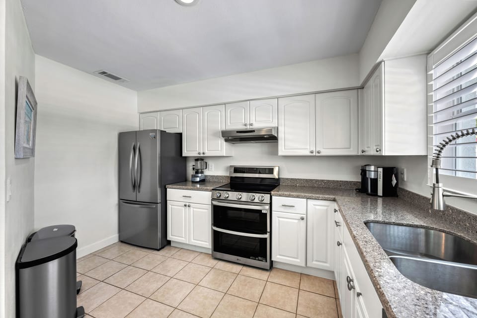 Whip up your favorite dishes in a sunlit kitchen.
