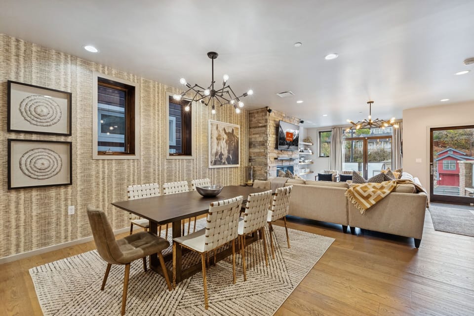 Open dining and living area with neutral tones and contemporary décor