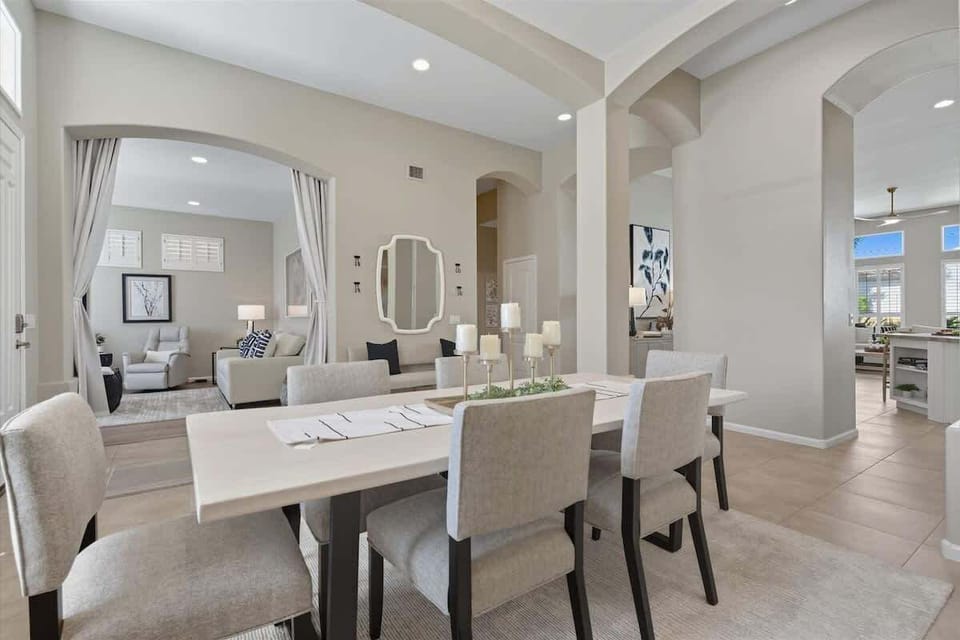 The dining area features a bright, inviting setting with seating for six, perfect for enjoying meals and conversation.