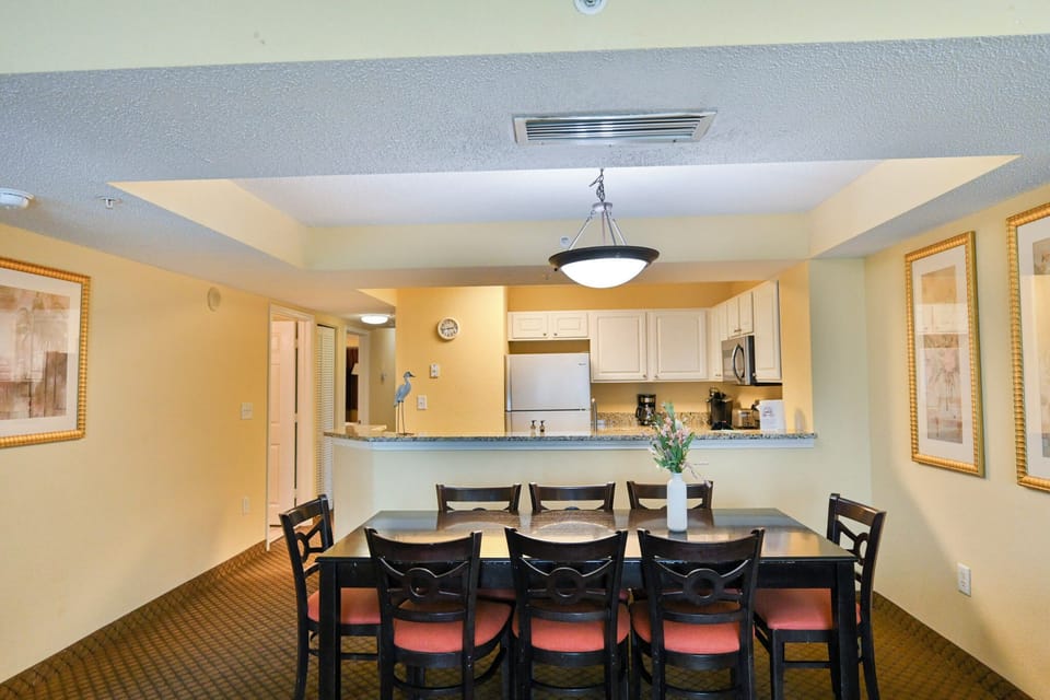 Spacious dining area with open kitchen and breakfast bar