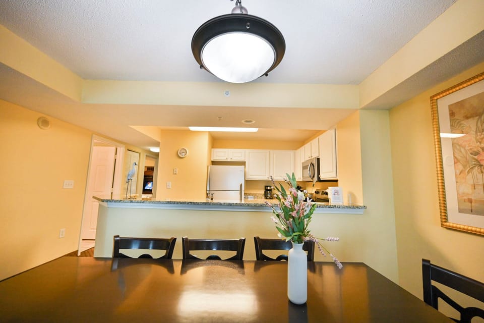 Spacious dining area with open kitchen and breakfast bar