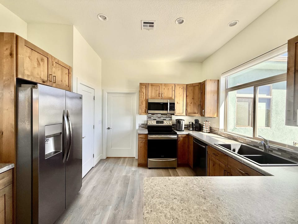 The fully appointed kitchen offers top of the line appliances, dishes, cutlery, and all the essentials.