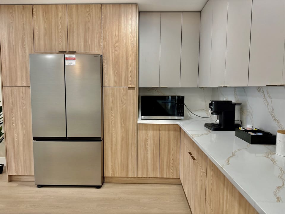 Start your day right in this cozy, light-filled kitchen equipped with all essentials and modern comforts.