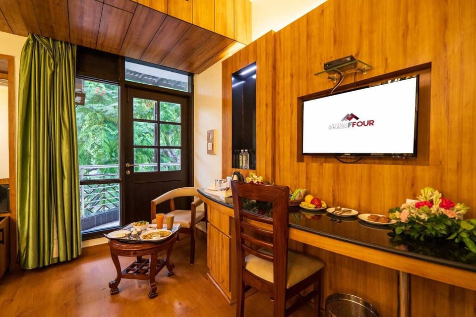 Deluxe Room, City View | Minibar, desk, laptop workspace, iron/ironing board