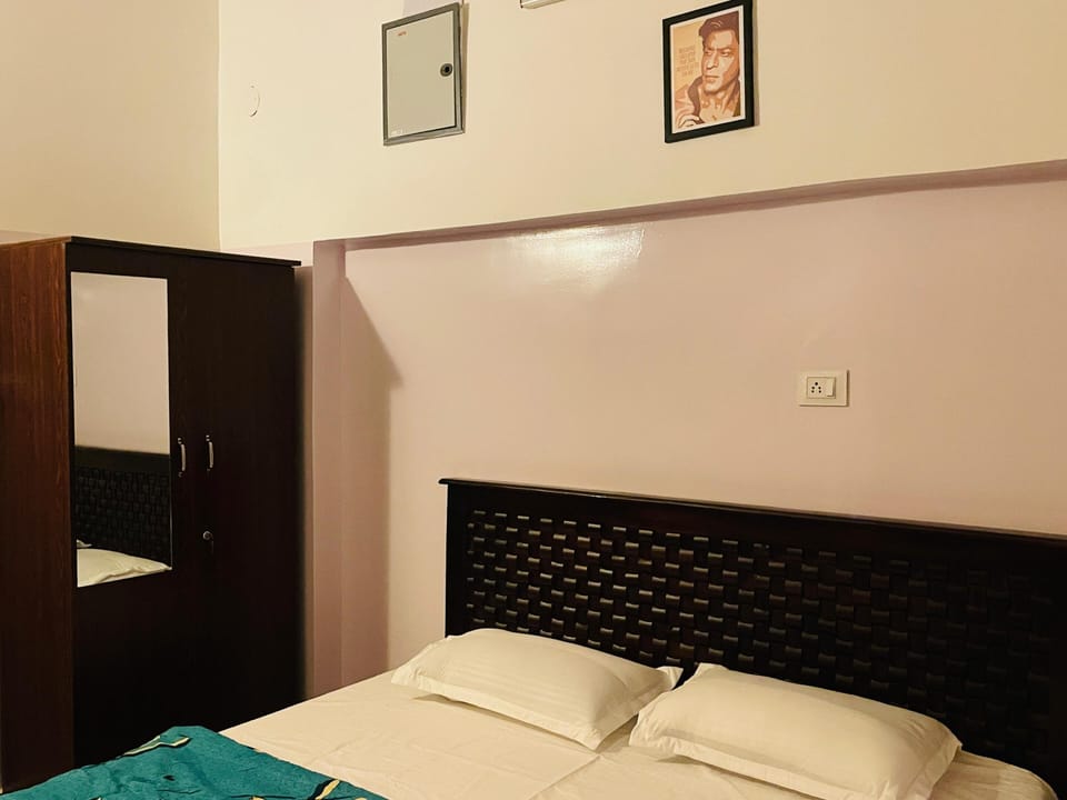 Deluxe Double Room, City View | Desk, laptop workspace, iron/ironing board