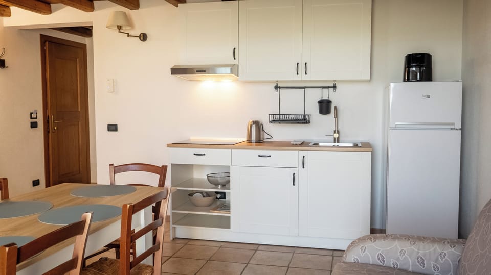 Panoramic Apartment, Garden View | Private kitchen | Highchair