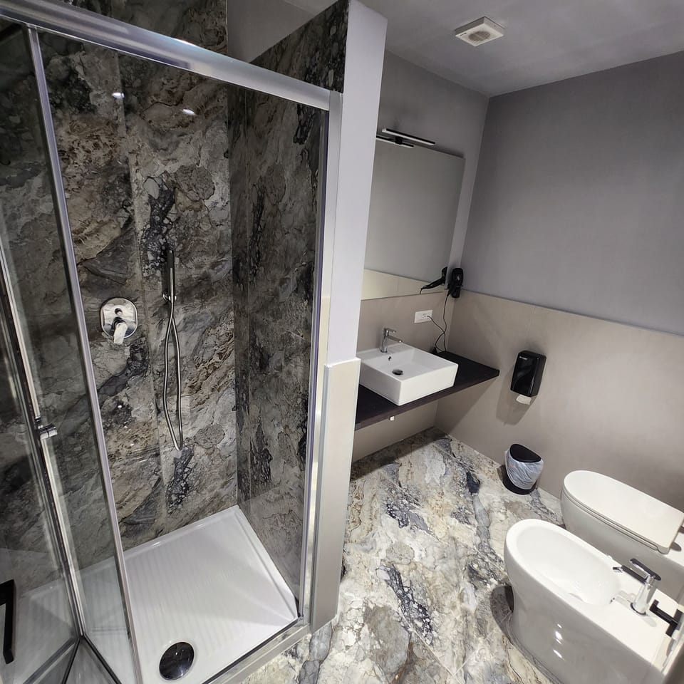 Panoramic Double or Twin Room, Balcony, Sea View | Bathroom | Shower, bidet, towels, soap