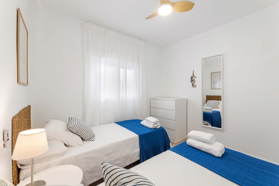 ☀️ Fresh air, soft linens, and a hint of ocean blue. A bright twin room that captures Lanzarote’s calm and the joy of simple moments. 🌊✨