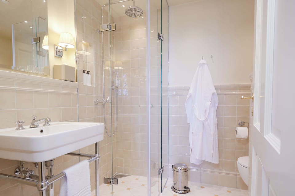 Shower, eco-friendly toiletries, hair dryer, bathrobes