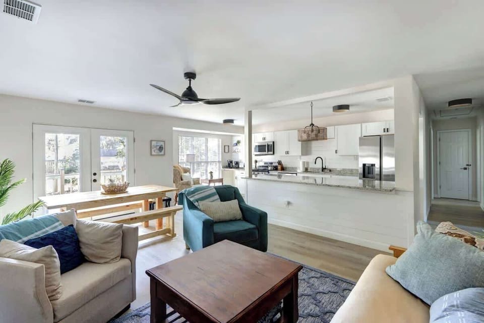 Open and Airy - This living room boasts ample space and abundant natural lighting, creating a bright and welcoming environment. 