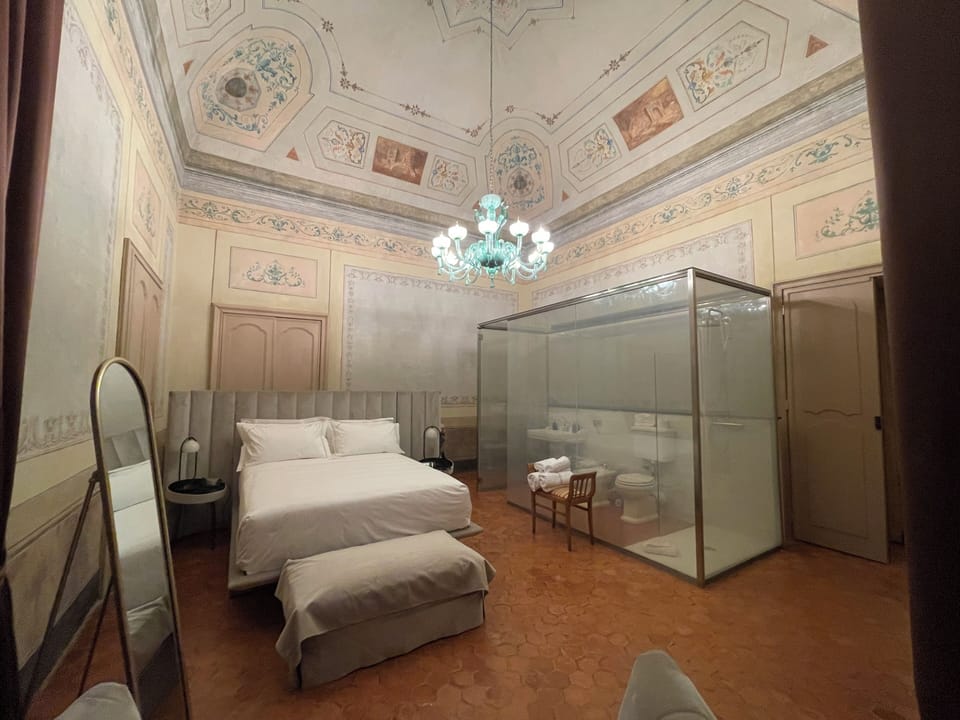 Luxury Suite, City View | Bathroom | Hair dryer, slippers, towels, soap