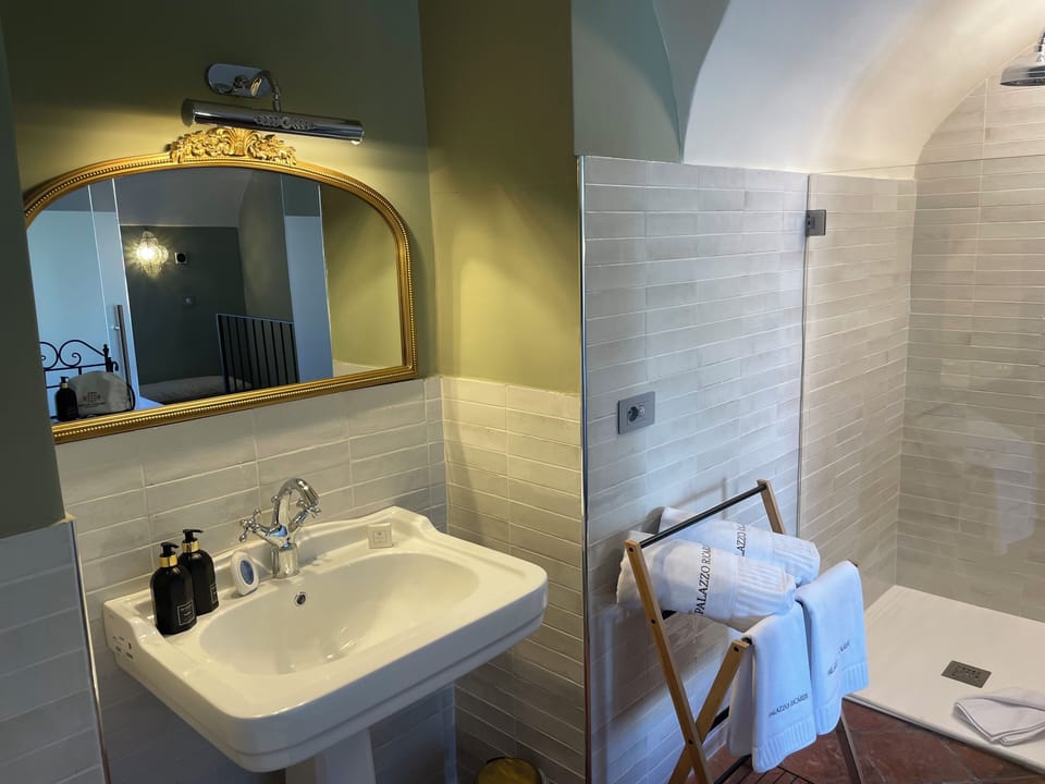 Family Quadruple Room, City View | Bathroom | Hair dryer, slippers, towels, soap