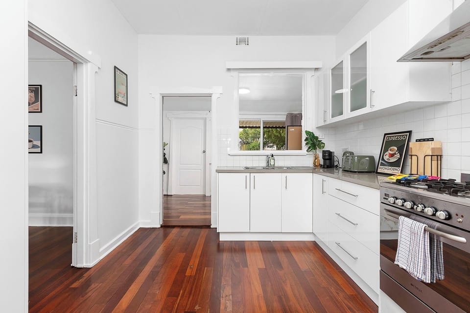Cook & Connect! Enjoy a functional and stylish kitchen with gas cooking, all the essentials, and easy flow to adjacent rooms.
