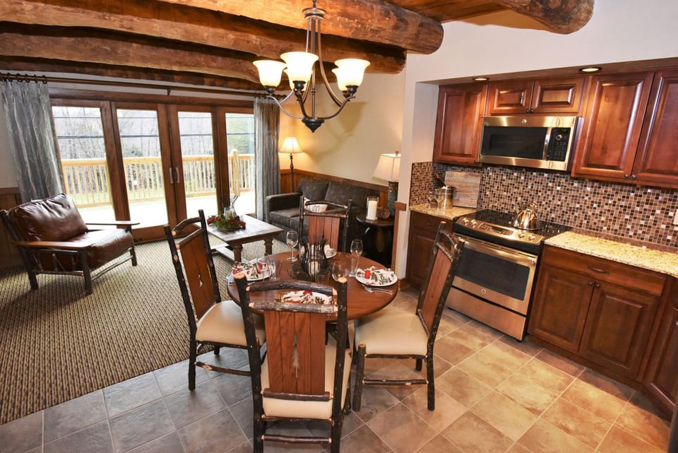  Bright kitchen and dining space with rustic accents, offering a welcoming atmosphere for family gatherings.