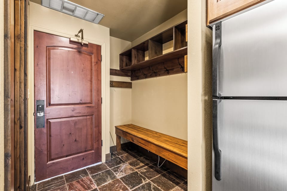 The entryway with a large bench and plenty of room for outdoor gear.