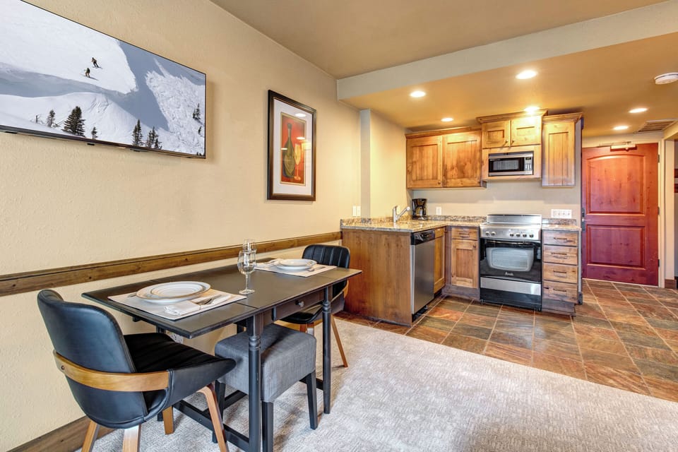 Your fully equipped kitchen with warm wood cabinets and granite counters.