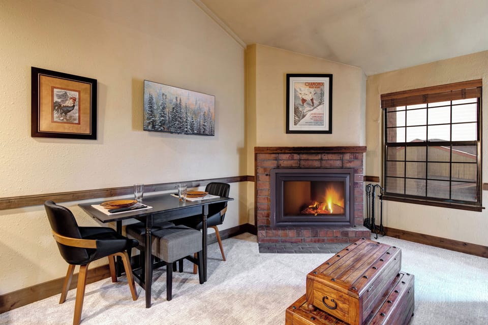 Cozy up by your crackling fireplace while enjoying intimate meals at your stylish dining table.