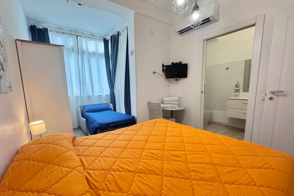 Deluxe Triple Room, City View | Premium bedding, desk, cribs/infant beds, free WiFi