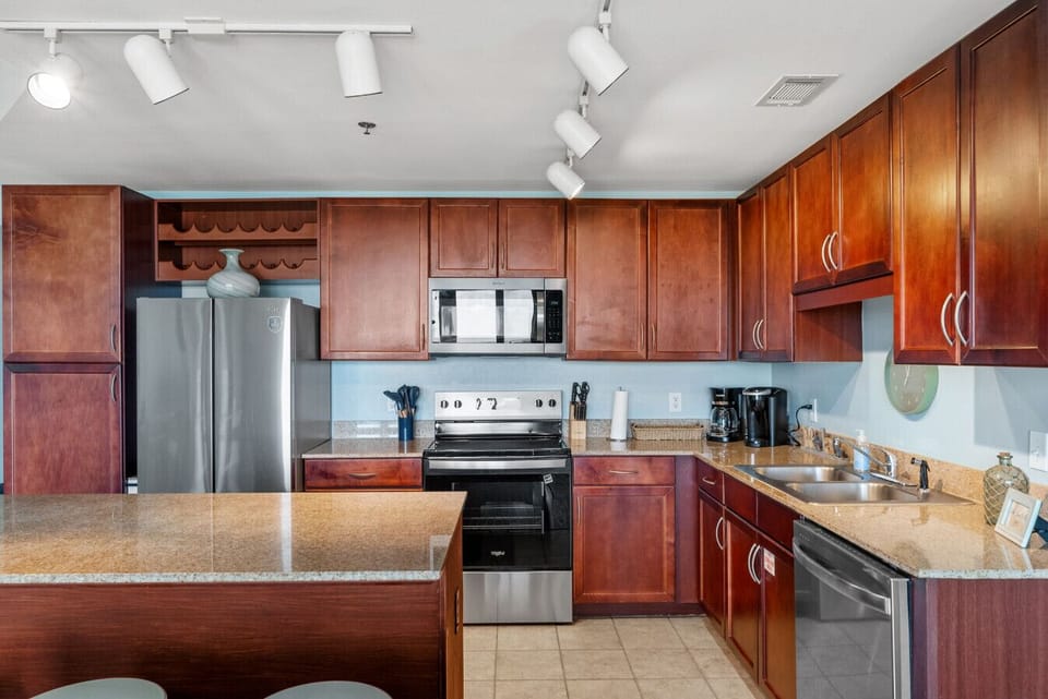 Kitchen: Fully equipped kitchen with modern stainless-steel appliances, granite countertops, and plenty of cabinet space for all your vacation cooking needs.
