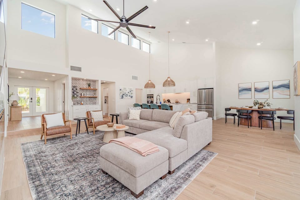 Expansive, open-concept living room filled with abundant natural light