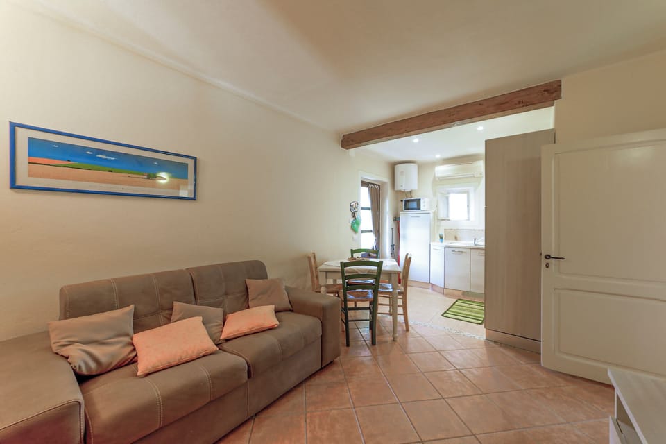 Classic Apartment, Garden View | Living area | 24-inch TV with digital channels