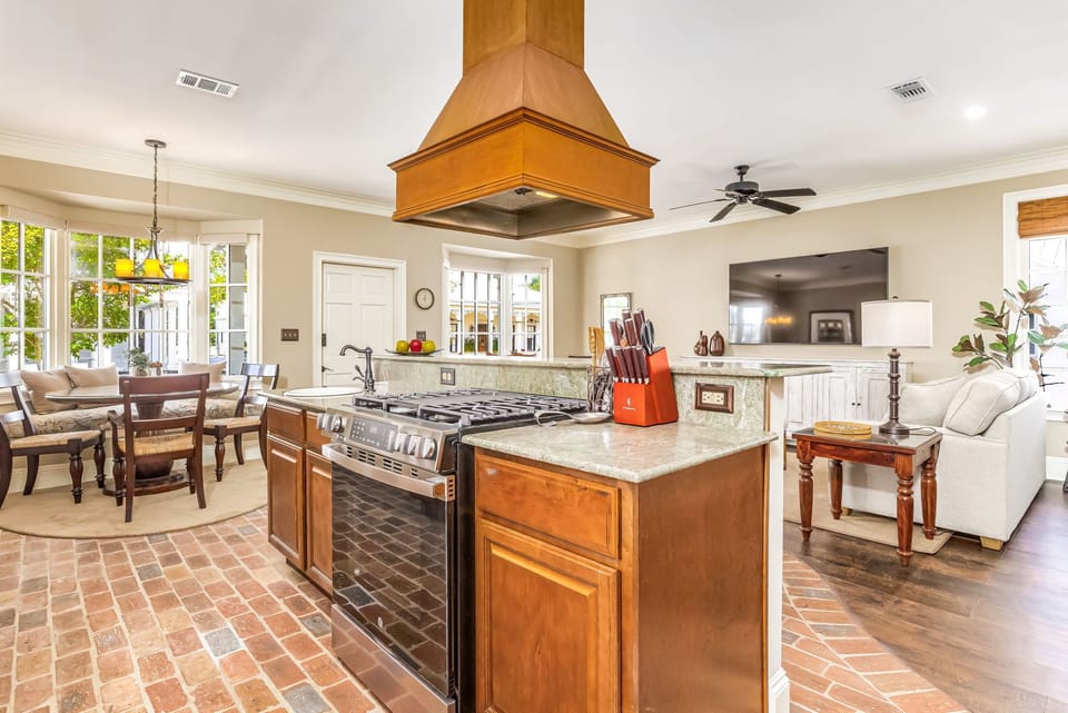 Open kitchen flows into living and dining areas - perfect for entertaining in downtown Pensacola