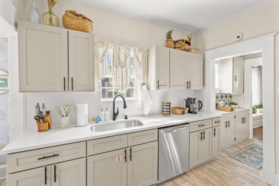Spacious kitchen view w/ generous counters, updated appliances, & room to prep meals comfortably.