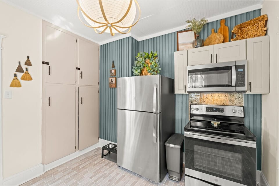 Full kitchen setup w/ stainless appliances, ample storage, & an efficient layout for home-cooked meals.