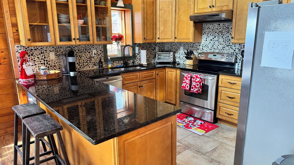 Cozy holiday kitchen with Christmas touches, ready for family meals and brunch.