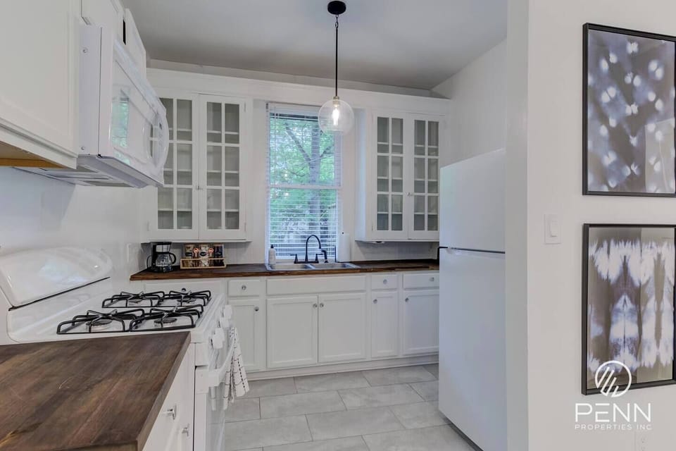 Start your mornings with fresh coffee and sunlight streaming through the kitchen window.