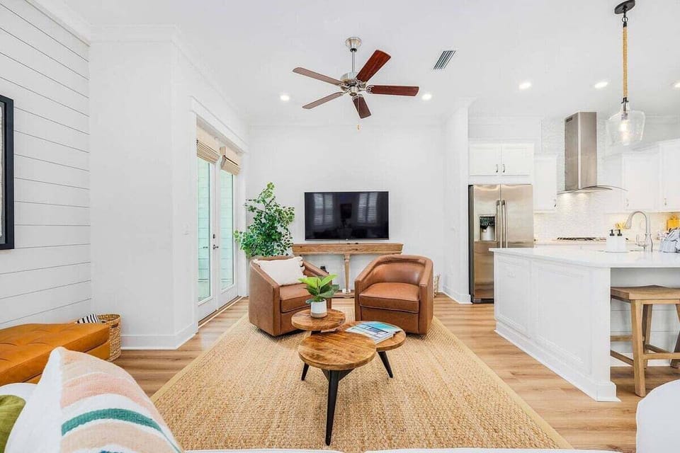 Living room space with ample seating to share in television viewing, game nights, and good conversation.